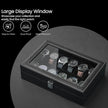 12-Slot Watch Box Organizer – Synthetic Leather – Black with Greenish Grey Lining – Large Glass Lid and Removable Watch Pillows