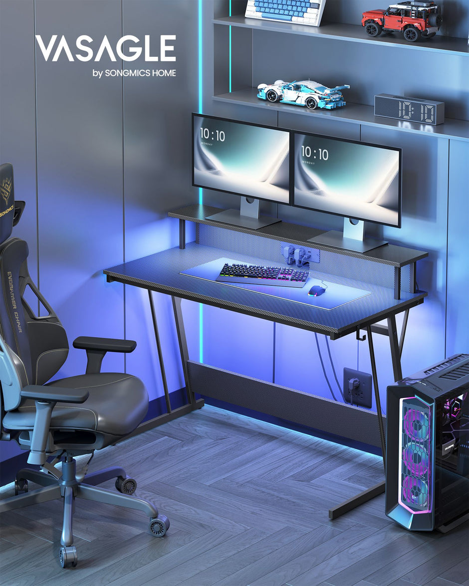Gaming Desk – Carbon Black – With LED Lights and Built-In Power Outlets, Monitor Shelf for Dual Monitors